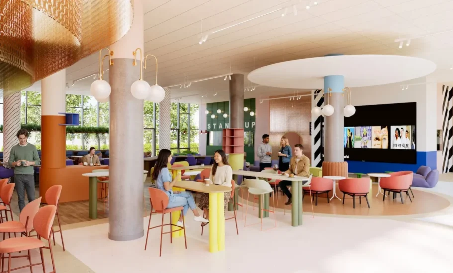 espace de vie Espace intérieur moderne avec des tables colorées et des chaises, des personnes en conversation.